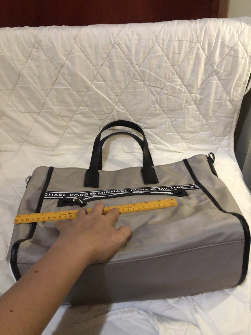 Michael Kors large nylon tote bag (Category: Luxury Bags & Wallets) located in Pasig City. Submitted by maricrism68145 (Listing ID 1435136040, Image 3). Description: Japan preloved,provided sling from furla.