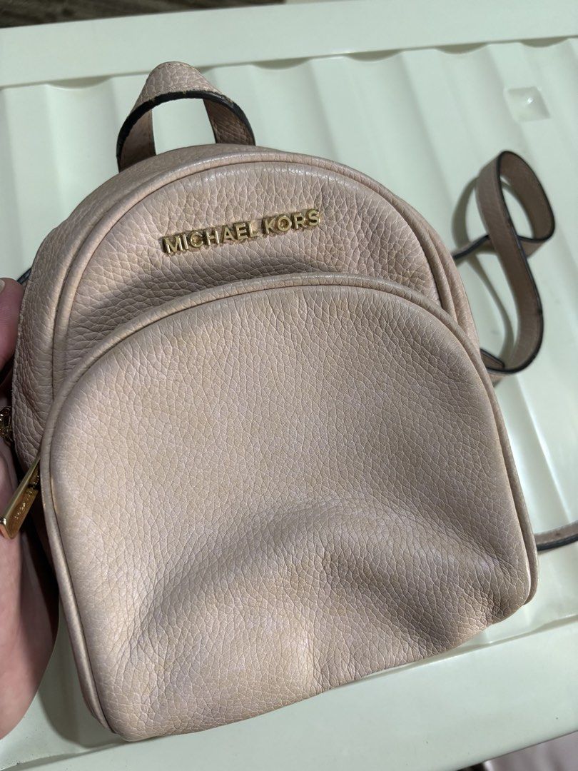 Authentic Michael Kors Mini Backpack (Category: Backpacks) located in Talavera. Submitted by charmaine.delima (Listing ID 1435052623, Image 2). Description: - Michael Kors mini backpack - Blush pink color - Gold-tone hardware - Top handle and adjustable straps - Sling bag/ Backpack - Main compartment and front pocket - With visible minimal stain .