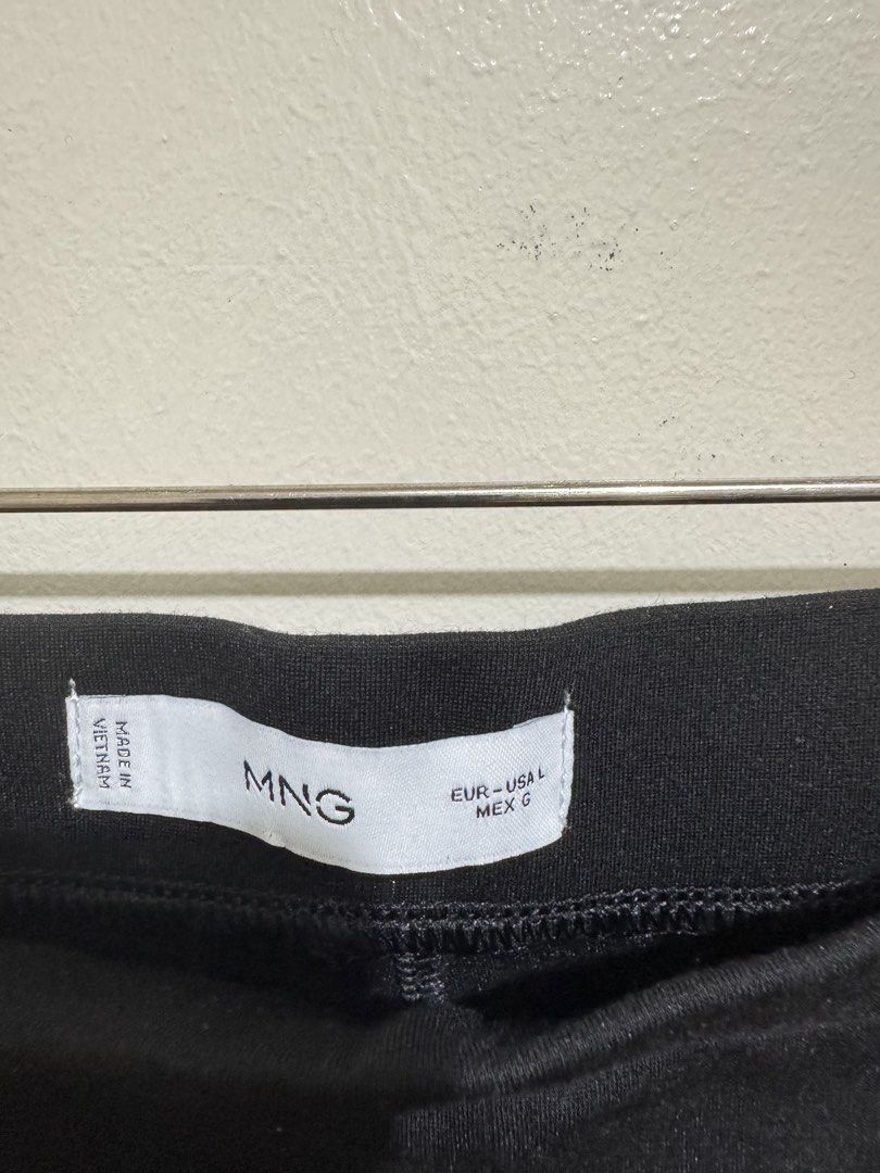 MNG Black Leggings with Slit (Category: Other Bottoms) located in Mandaluyong City. Submitted by riaria03 (Listing ID 1435076493, Image 3). Description: - Features a comfortable fit with a slit detail at the hem. - Perfect for everyday wear or dressing up. A versatile addition to any wardrobe. - Used only once 📍Please note that actual colors may slightly vary due to lighting and camera effects. ✅ Items are either preloved or brand new. Please ma