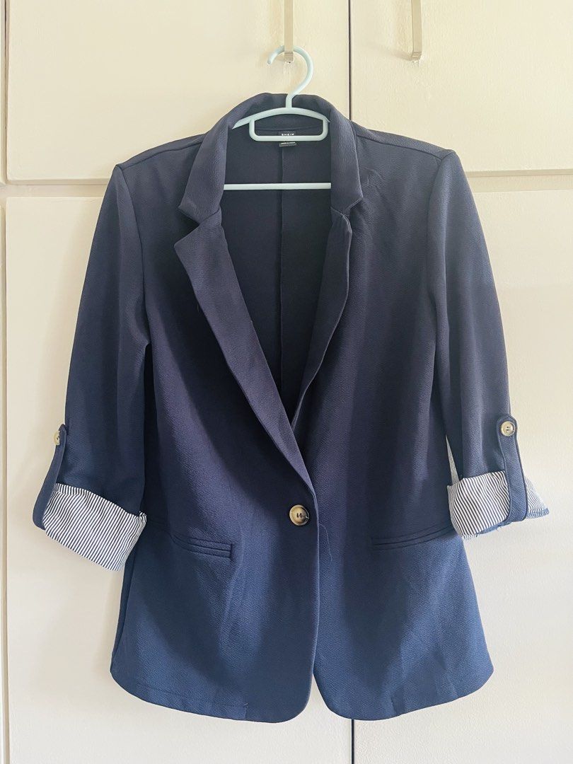 Navy Blue Blazer (Category: Coats, Jackets and Outerwear) located in Pasig City. Submitted by TrishODeclutter (Listing ID 1435074798, Image 1). Description: - Brand new, never used, just washed - Shein Lune navy blazer - Size: S RFS: Decluttering pre-pregnancy clothes, does not fit anymore 🥲 Pick up: Pasig, near Tiendesitas (buyer books for pick up).
