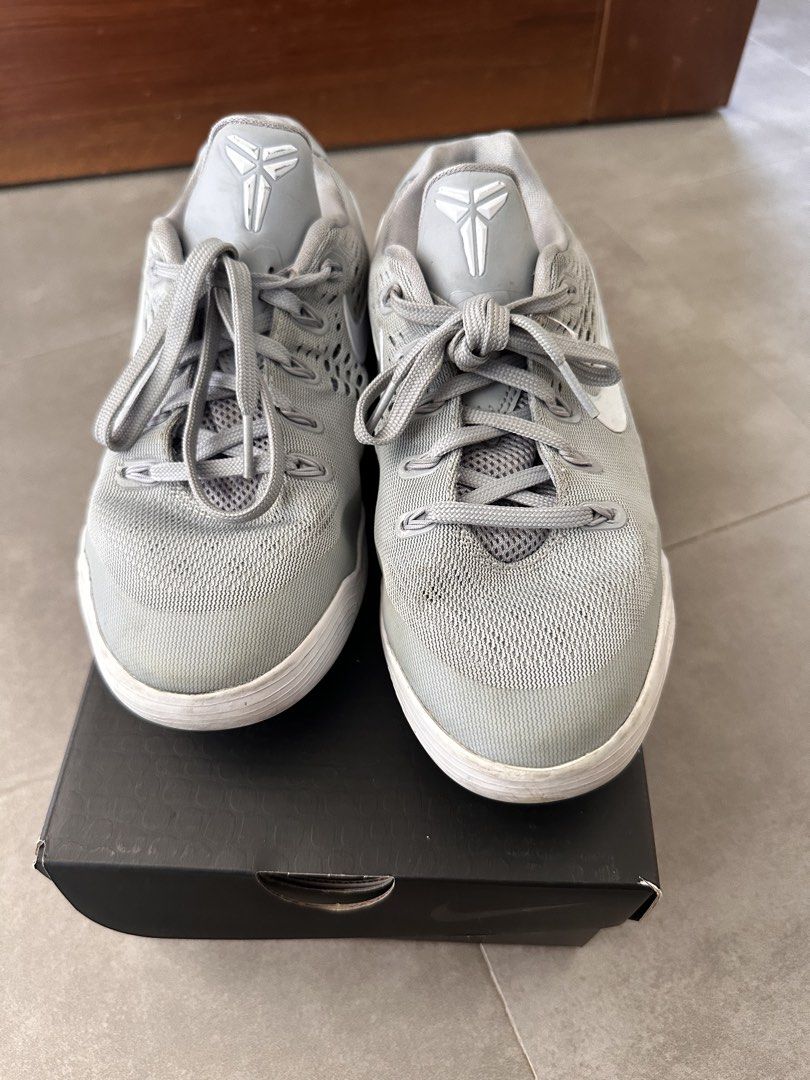 Nike Kobe IX Low EM (GS) Grey/White (Category: Sneakers) located in Naga. Submitted by jenni2003 (Listing ID 1435000935, Image 3). Description: Nike Kobe IX Low EM (GS) in grey and white. The shoes come with the original box. Size is 4.5Y, UK 4, CM 23.5, and BR 35. The box has the Kobe logo and signature. The shoes have grey laces and a grey upper. The soles are white..