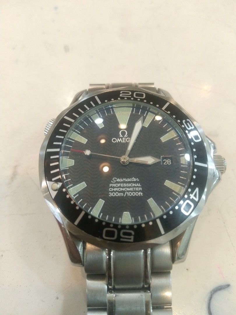 Omega Seamaster Professional 300m Watch (Category: Luxury Watches) located in Manila. Submitted by epicwind_1bf746 (Listing ID 1432578968, Image 1). Description: - Omega Seamaster Professional - Black dial - Stainless steel bracelet - Date display at 3 o'clock - Unidirectional rotating bezel - Omega Seamaster logo on case back - Omega logo on clasp.