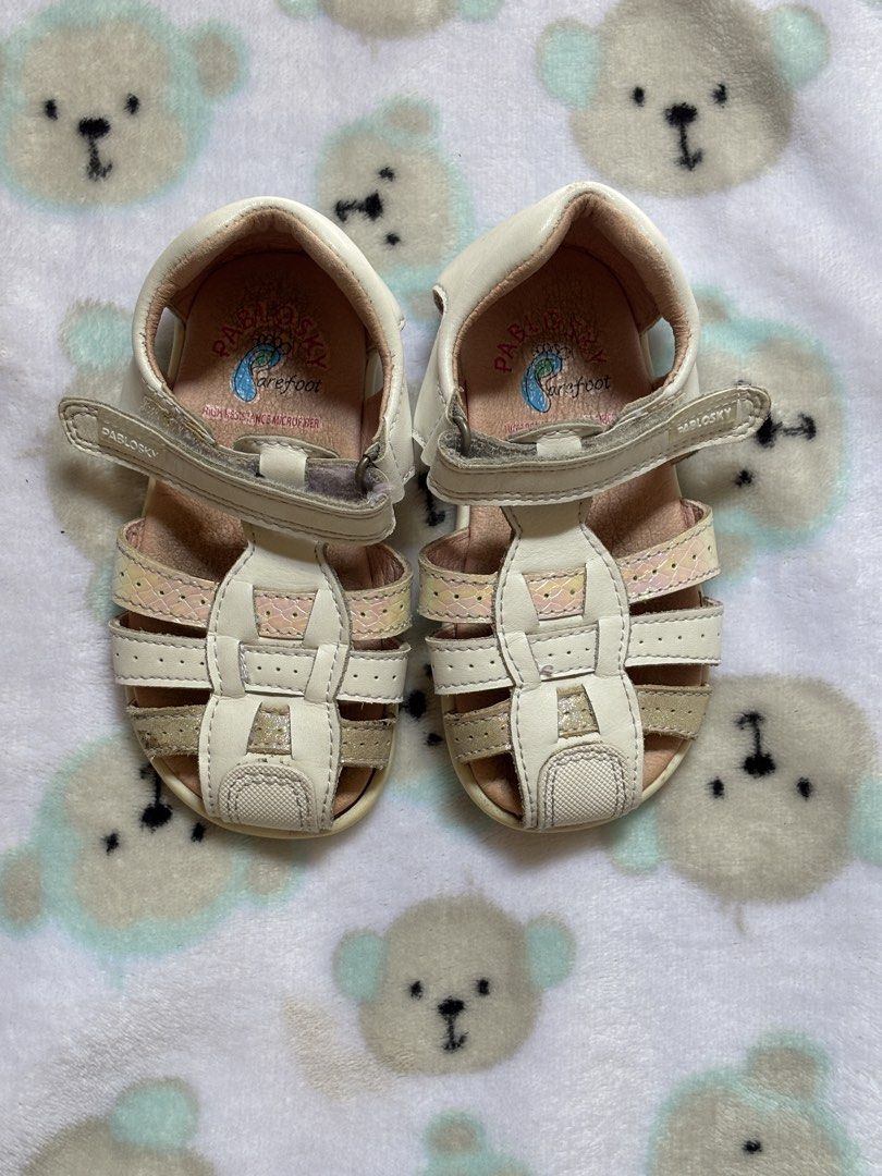 Pablosky Barefoot Sandals (Category: Flats & Sandals) located in San Juan City. Submitted by prelaabthings (Listing ID 1435026400, Image 1). Description: Pablosky sandals, designed for barefoot comfort. White and beige color, velcro strap for easy adjustment. Multi-strap design, likely leather. 13.5cm insole .