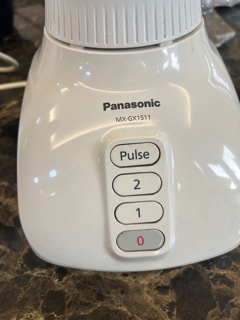 Panasonic MX-GX1511 Blender (Category: Juicers, Blenders & Grinders) located in Makati City. Submitted by declutter__queen (Listing ID 1435046278, Image 1). Description: - Panasonic MX-GX1511 Blender - Multiple speed settings: 0, 1, 2, and Pulse - Clear plastic jug - White base - Includes lid and power cord - Features a warning label on the base.