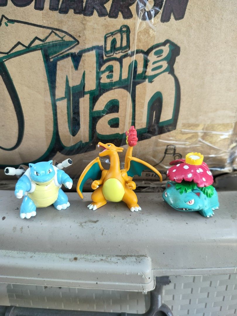 Pokemon Figures Set (Category: Figurines & Statues) located in Plaridel. Submitted by klayskolektibols (Listing ID 1435087335, Image 1). Description: - Pokemon figure set featuring Blastoise, Charizard, and Venusaur. - Made of colorful plastic. - Great addition to any Pokemon collection. - Figures are displayed on a surface with a Filipino text background..
