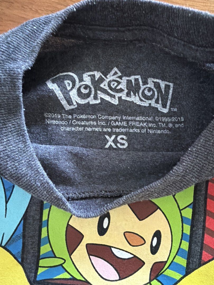 Pokemon T-shirt XS (Category: Babies & Kids Fashion) located in Las Pinas. Submitted by oliveguns (Listing ID 1435072196, Image 2). Description: - Pokemon T-shirt - Size: XS fits 6-8yo - Width: 15 inches - Color: Dark Gray.