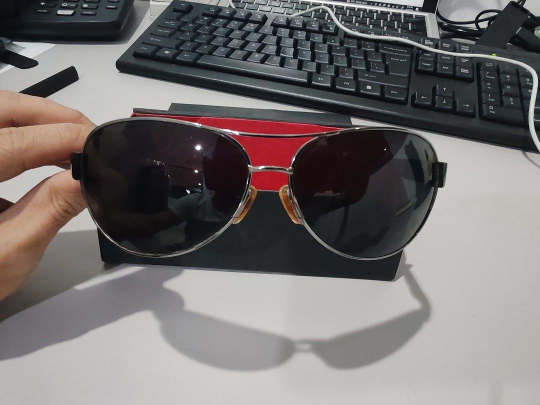 Polaroid Sunglasses with Case unisex (Category: Announcements) located in Pasig City. Submitted by geraldnee28280 (Listing ID 1435083980, Image 1). Description: - Silver frame aviator sunglasses - Dark lenses - Black arms - not sure if this is the originap box, Includes black storage box with red interior.