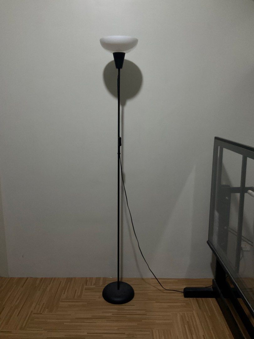 [PRELOVED] IKEA Black Floor Lamp with White Shade (Category: Lighting) located in Quezon City. Submitted by _aceys (Listing ID 1435140863, Image 2). Description: - Modern floor lamp design. - Provides warm, indirect lighting. - Includes a power cord for easy setup and use..