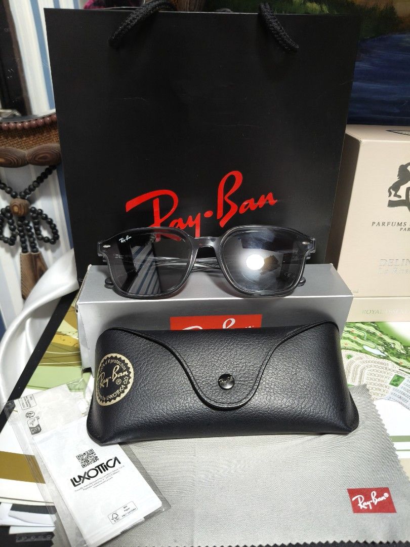 Ray-Ban Sunglasses (Category: Sunglasses & Eyewear) located in Manila. Submitted by stuff_finder (Listing ID 1435015649, Image 3). Description: - Authentic Ray-Ban sunglasses - Includes original case, cleaning cloth, and paperbags - Features a dark frame and lenses - Comes with the original Ray-Ban shopping bag and box - Ideal accessory for everyday wear -Unisex bought mall 15k selling low.