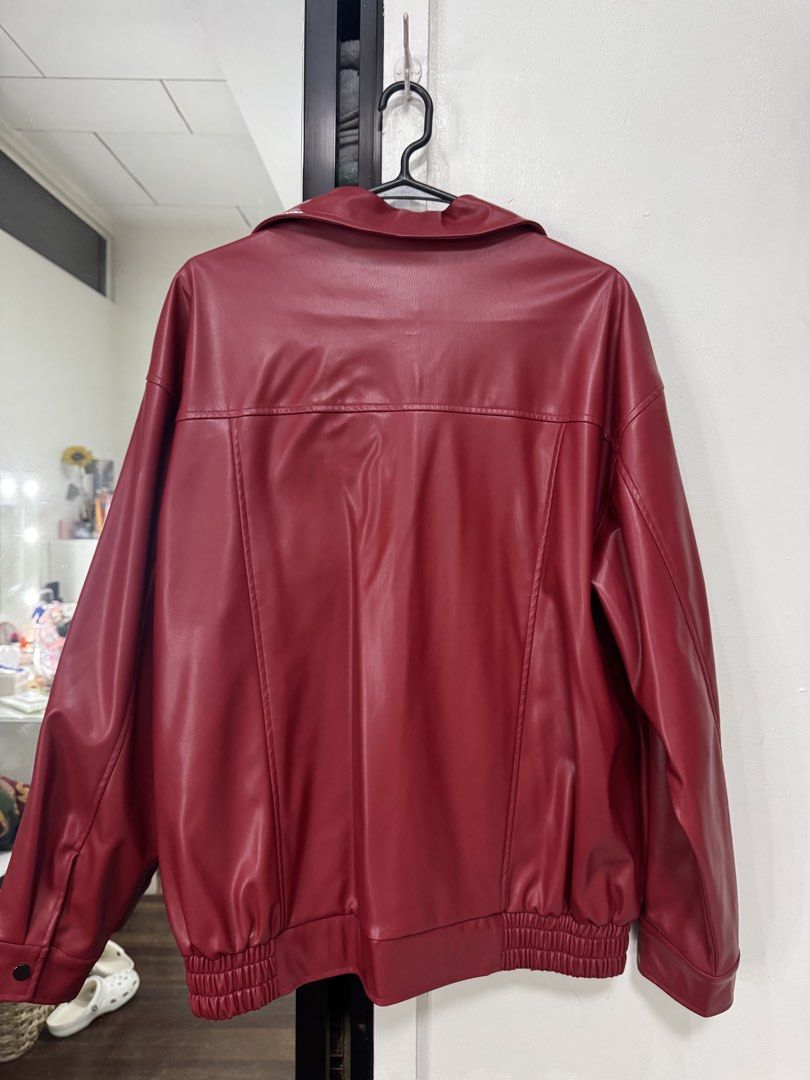 SHEIN Red Faux Leather Jacket - Size L (Category: Coats, Jackets and Outerwear) located in Valenzuela. Submitted by prelovedbykendall (Listing ID 1435111159, Image 3). Description: - SHEIN Red Faux Leather Jacket - Size: L - Features: - Zip-up front - Collared neckline - Elastic cuffs and hem - Two front pockets - Stylish and versatile design.