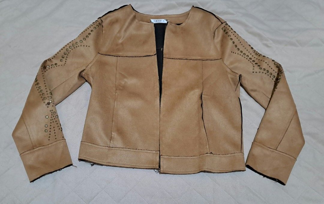 Tan Suede Jacket with Studded Sleeves (Category: Coats, Jackets and Outerwear) located in Baguio. Submitted by Zibs_Collection (Listing ID 1435084572, Image 1). Description: - Stylish tan suede jacket - Studded sleeves - Classic open front - Black inner lining fits xs to small, no more LP.