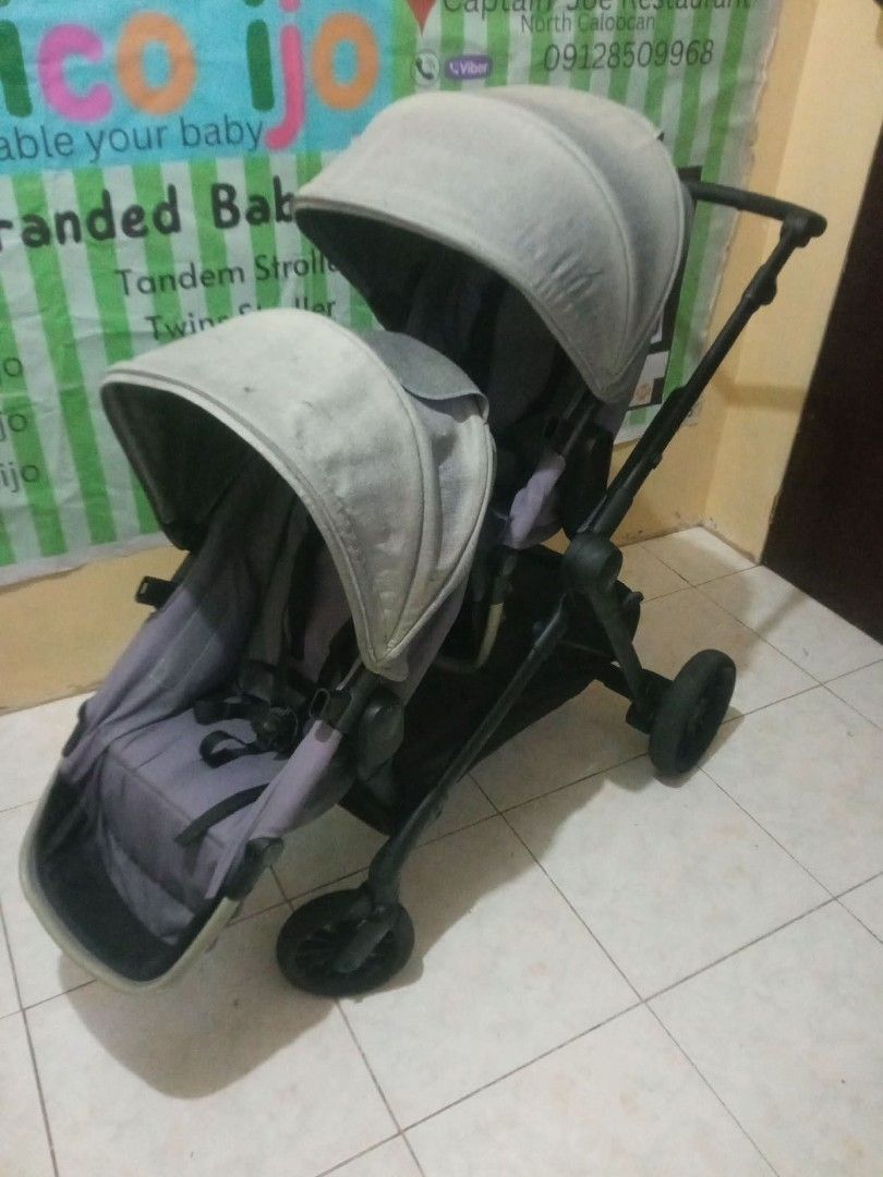 Tandem Stroller (Category: Strollers) located in Caloocan City. Submitted by Unicoijo02 (Listing ID 1435062531, Image 2). Description: - Double stroller - Two seats with canopies - Black frame - Gray seats - Storage basket included - Four wheels - Perfect for two children.