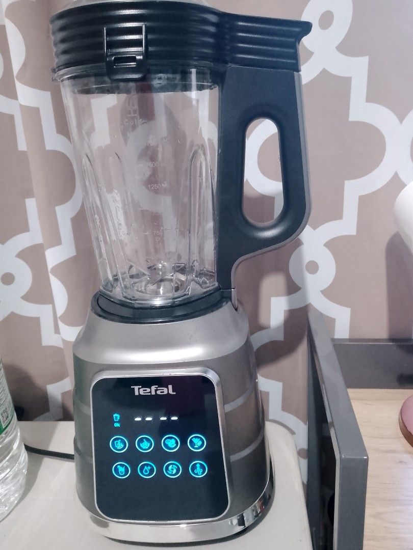 Tefal Blender (Category: Juicers, Blenders & Grinders) located in Manila. Submitted by badkiss_coffee26 (Listing ID 1435057693, Image 3). Description: - Sleek Tefal blender with a modern design. - Features a user-friendly digital control panel. - Offers multiple pre-set functions for various blending tasks. - Comes with a large capacity container. - Equipped with a sturdy handle for easy pouring. - Boasts a stylish metallic base. - Perfect for ma