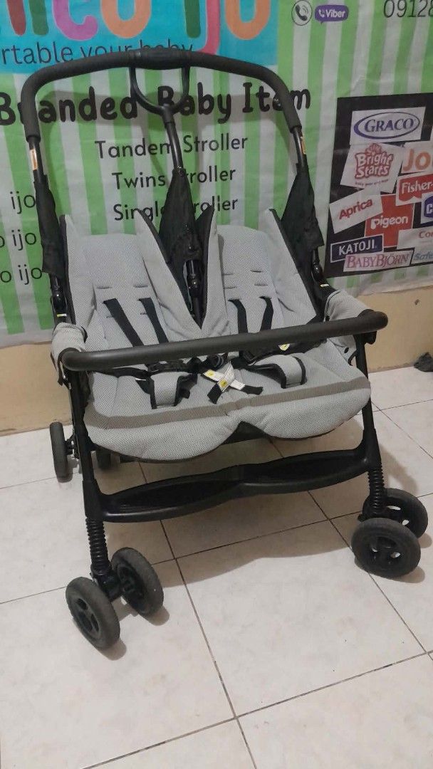 Twin (Category: Strollers) located in Caloocan City. Submitted by Unicoijo02 (Listing ID 1435062410, Image 3). Description: - Tandem stroller ideal for twins or siblings. - Two seats with safety harnesses. - Stylish black frame with gray seats. - Foldable design for convenient storage and transport. - Durable wheels suitable for various terrains. - High-quality, branded baby item..