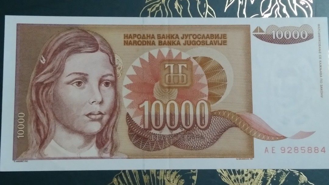 Yugoslavia 10000 Dinara Banknote (Category: Currency) located in Cainta. Submitted by patrickwilsonstore (Listing ID 1435165854, Image 1). Description: - Yugoslavian 10000 Dinara banknote - Year: 1989 - Features a portrait of a young woman - Serial number: AE 9285884 - From Beograd unc. but with fold. .