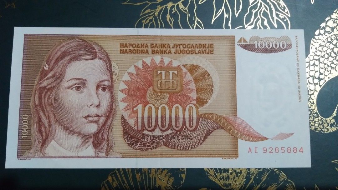 Yugoslavia 10000 Dinara Banknote (Category: Currency) located in Cainta. Submitted by patrickwilsonstore (Listing ID 1435165854, Image 2). Description: - Yugoslavian 10000 Dinara banknote - Year: 1989 - Features a portrait of a young woman - Serial number: AE 9285884 - From Beograd unc. but with fold. .
