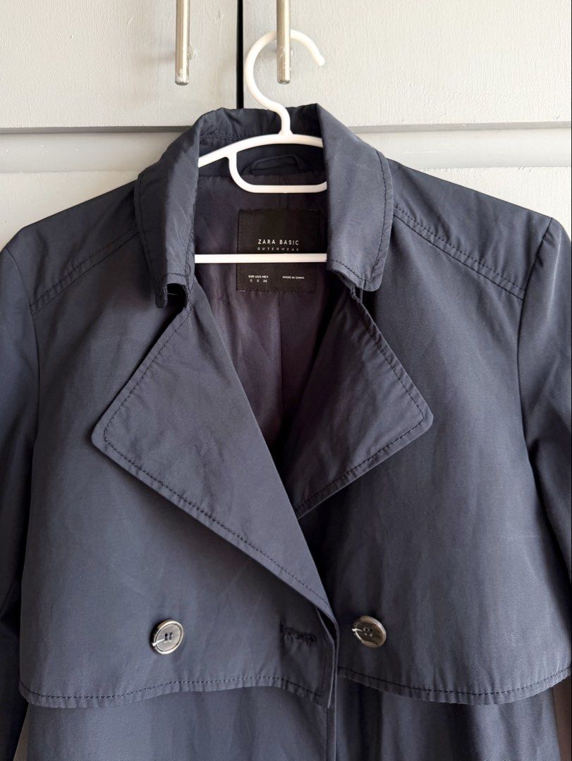 Zara Basic Navy Blue Trench Coat (Category: Coats, Jackets and Outerwear) located in San Juan City. Submitted by itemsfromkam (Listing ID 1435045317, Image 3). Description: • S on tag • has belt, button details, back flap, excellent used condition (worn 1x) • v chic and super nice!! • approx. measurements: shoulders: 15.5" bust: 17-19" laid flat length: 35.5" arm length: 23".