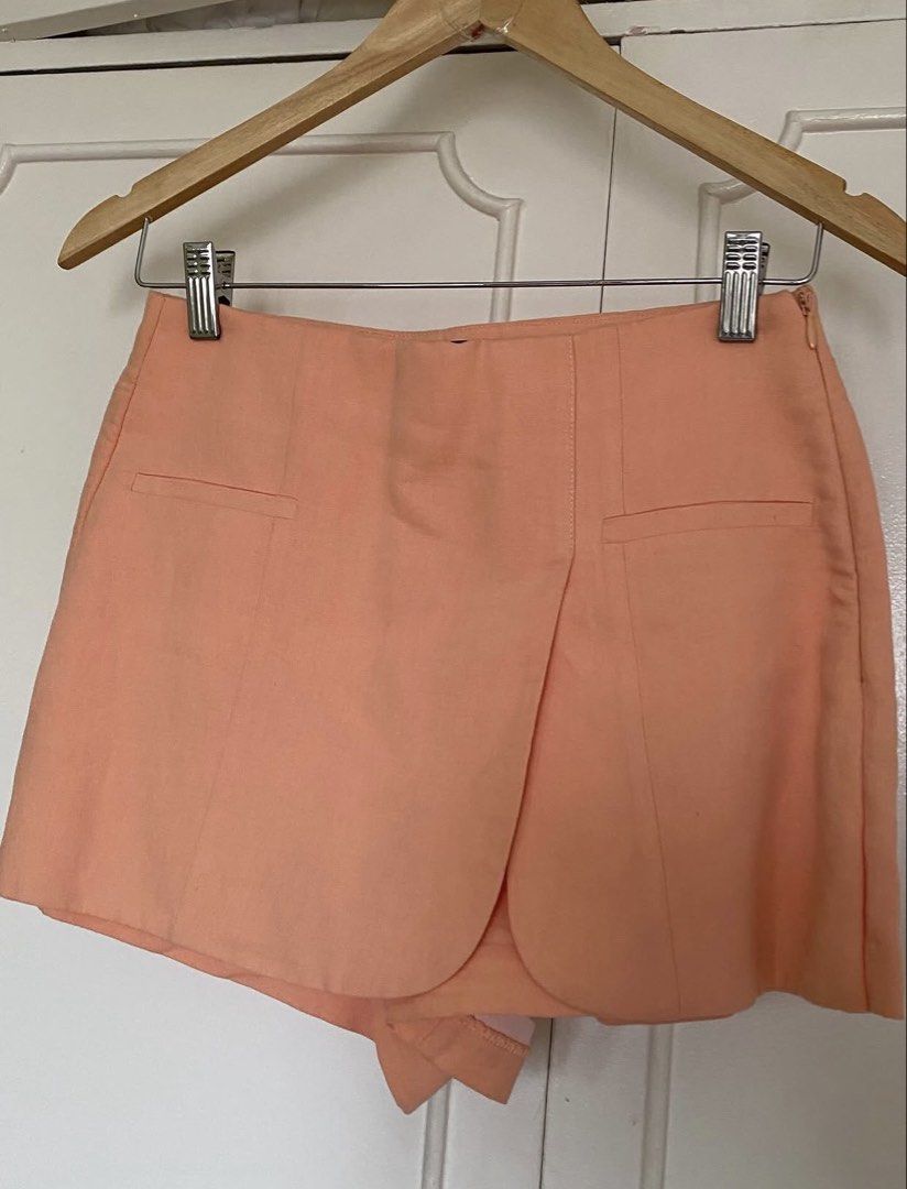 Zara Peach Blazer and Shorts Set (Category: Sets or Coordinates) located in Manila. Submitted by byebuyna (Listing ID 1435044413, Image 3). Description: - Zara peach blazer and shorts set - Blazer: short sleeves, single-button closure - Skorts: unique wrap design - Perfect for casual or semi-formal wear - A versatile wardrobe addition.