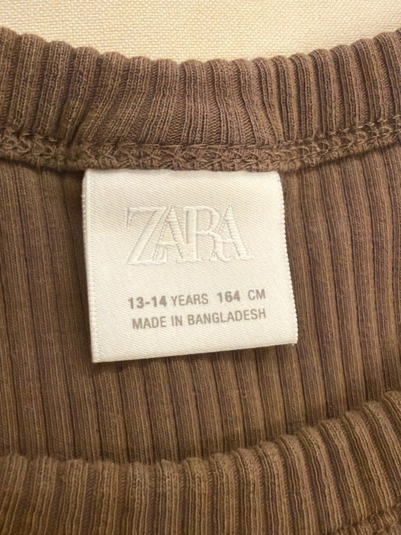 Zara Ribbed Tank Top (Category: Sleeveless) located in Paranaque City. Submitted by triciadeclutter (Listing ID 1435145664, Image 2). Description: - Zara brown ribbed tank top - Size: 13-14 years fits adult XS to semi M (stretchy) - Versatile piece for layering or wearing alone.
