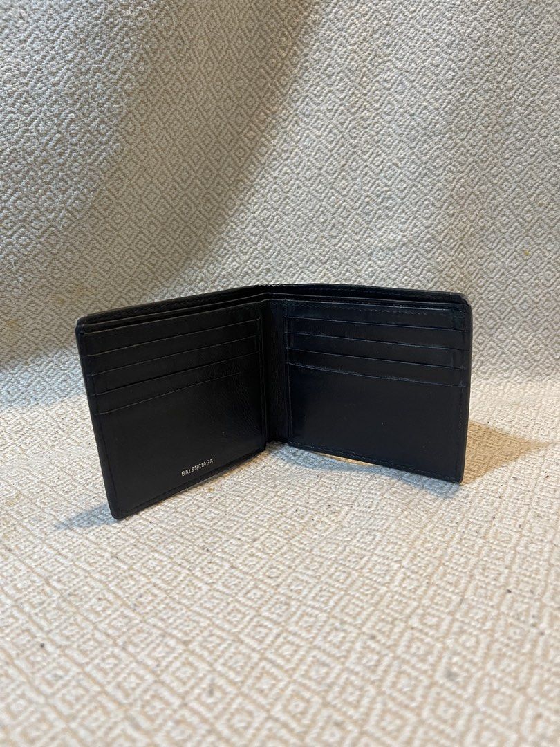 Balenciaga Black Leather Wallet (Category: Luxury Bags & Wallets) located in Manila. Submitted by hypestock_mnl (Listing ID 1430004475, Image 2). Description: - Balenciaga black leather bifold wallet. - Classic design. - Features multiple card slots. - Made from quality leather..