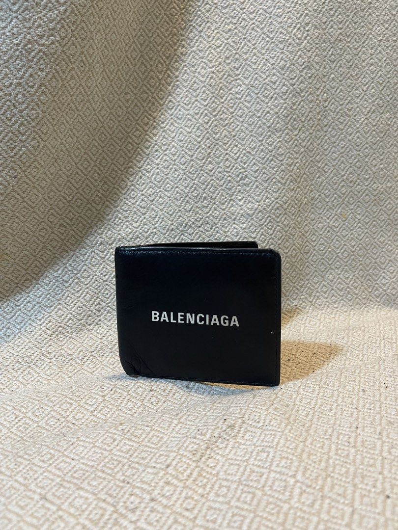 Balenciaga Black Leather Wallet (Category: Luxury Bags & Wallets) located in Manila. Submitted by hypestock_mnl (Listing ID 1430004475, Image 1). Description: - Balenciaga black leather bifold wallet. - Classic design. - Features multiple card slots. - Made from quality leather..