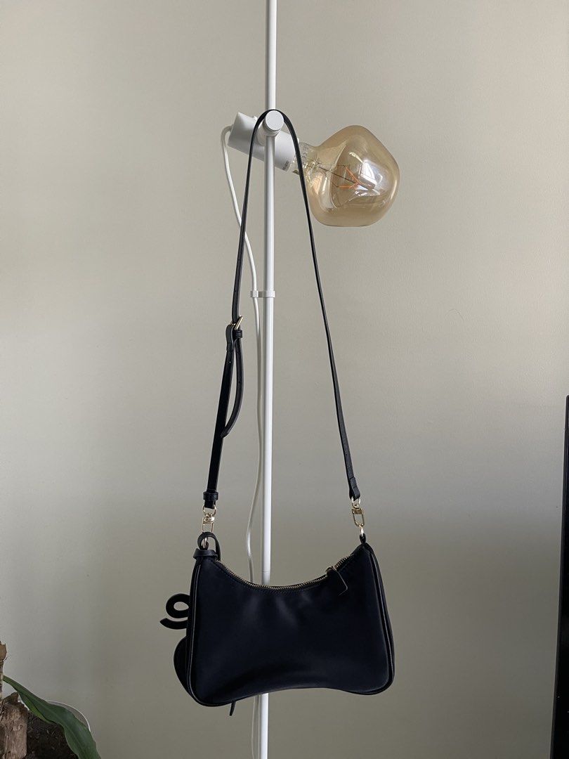 Black Shoulder Bag with Heart Charm (Category: Shoulder Bags) located in Manila. Submitted by declutterwnikki (Listing ID 1429981208, Image 3). Description: 🖤 Little Bunny Black Shoulder Bag w/ Heart Pouch 🖤 Selling this super cute Little Bunny shoulder bag ✨ ✔️ Comes with heart-shaped coin pouch (removable 💖) ✔️ Sleek black design – matches everything ✔️ Gold hardware for a classy touch ✔️ Can be worn shoulder or crossbody ✔️ Perfect for dail