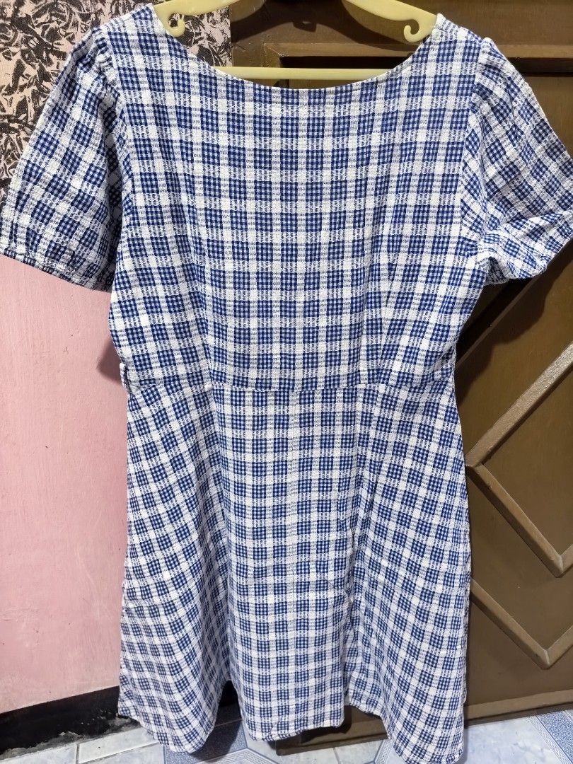 Blue and White Plaid Dress (Category: Dresses) located in Dinalupihan. Submitted by colinnoceda (Listing ID 1430002466, Image 3). Description: Dress features a blue and white plaid pattern. It has a square neckline and short sleeves. The dress has a fitted bodice and flares out at the waist. The back of the dress is also plaid.🎁💃.