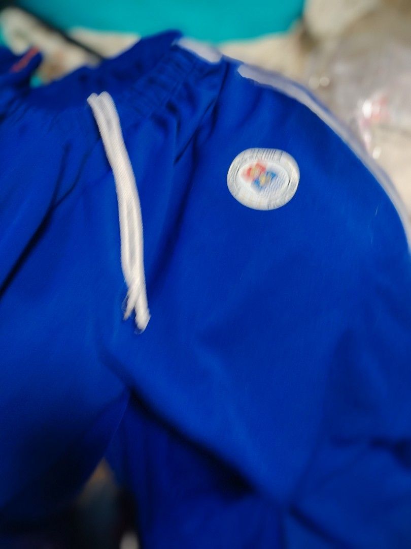 Blue Track Pants with White Stripes (Category: Joggers) located in Manila. Submitted by fnicolas (Listing ID 1429925870, Image 2). Description: Small to Large, garterized waist Bundle of 5 My son graduated from highschool.
