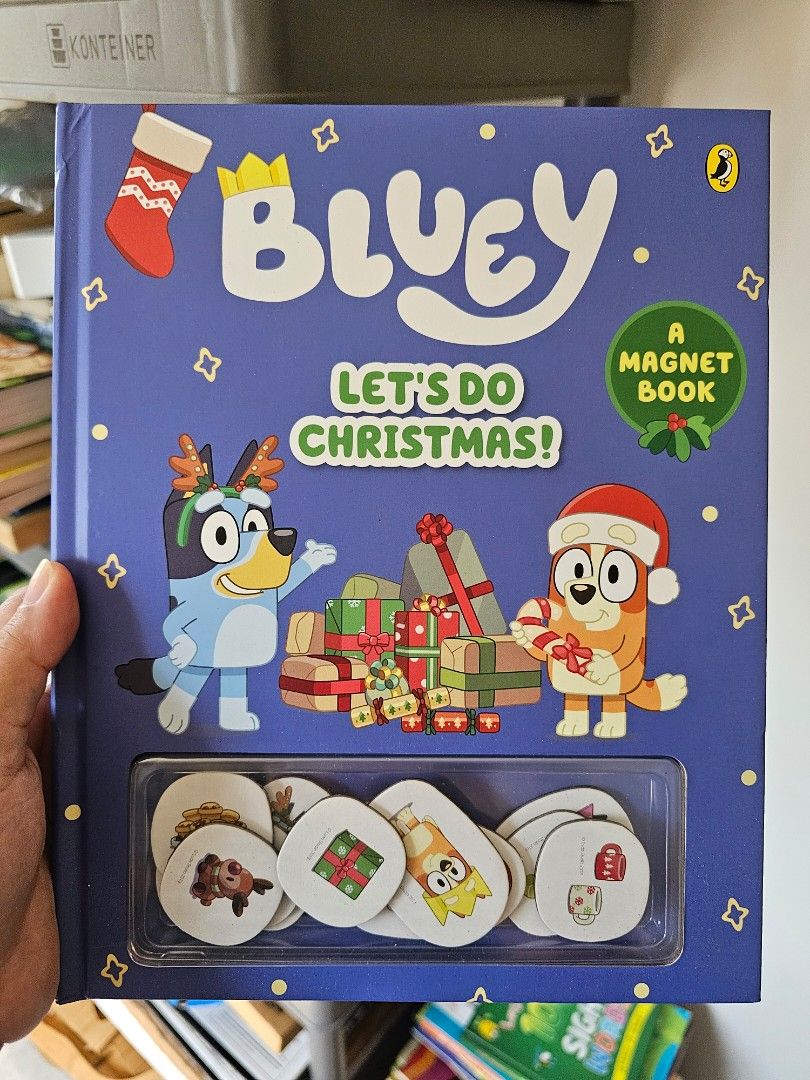 Bluey Let's Do Christmas! Magnet Book (Category: Children's Books) located in Manila. Submitted by bonitalamama (Listing ID 1429904170, Image 1). Description: Bluey "Let's Do Christmas!" magnet book. It features Bluey and friends in festive Christmas scenes. The book includes a set of magnets for interactive play. Perfect for young Bluey fans to enjoy during the holiday season. The book is designed to be a fun and engaging activity..