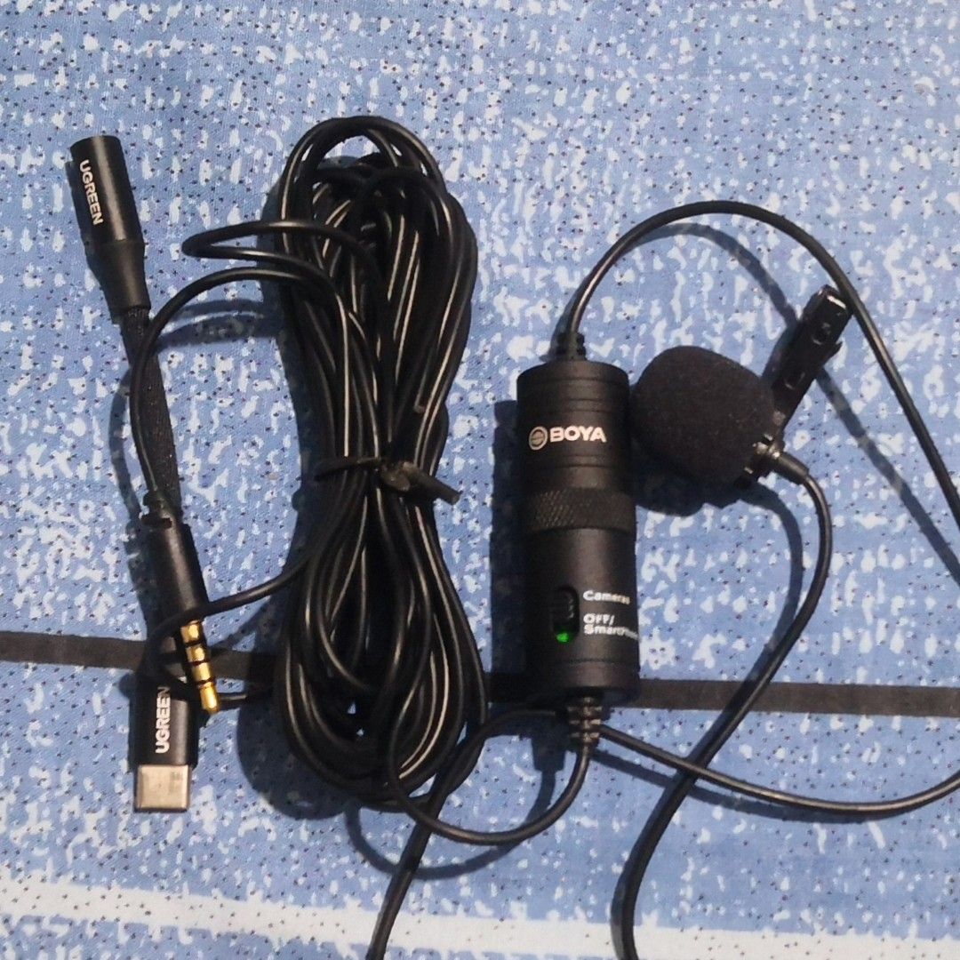 BOYA BY-M1 Lavalier Microphone with UGREEN Adapter (Category: Microphones) located in Dagupan City. Submitted by ptrvncnt (Listing ID 1429959155, Image 1). Description: Boya BY-M1 Omni-Directional Lavalier Lapel Microphone for Smart Phones Wired lapel. Used a couple of times tapos tinago na. No box or pouch. Selling for 400 pesos. Shipping is already free via J&T. Gcash payment. Location is Pangasinan. Working well. Aesthetic is around 98% good. 