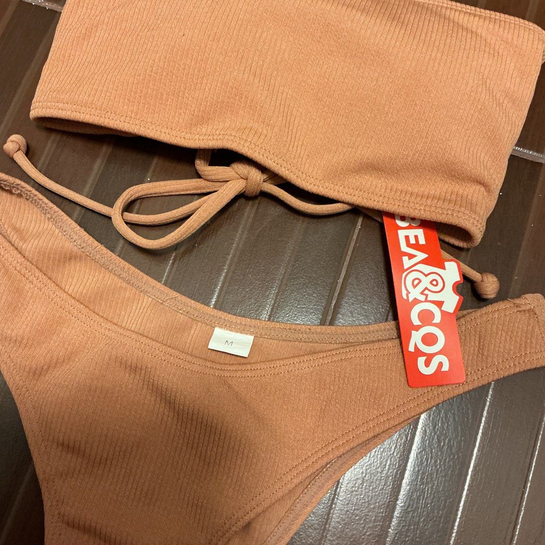 Brandnew swimsuit two-piece bikini (Category: Bikinis & Swimsuits) located in Manila. Submitted by ___purpleeeet__ (Listing ID 1429879868, Image 2). Description: Orange tube with tag and plastic - 99php S-M size Highwaist black with plastic - 99php S-M size.