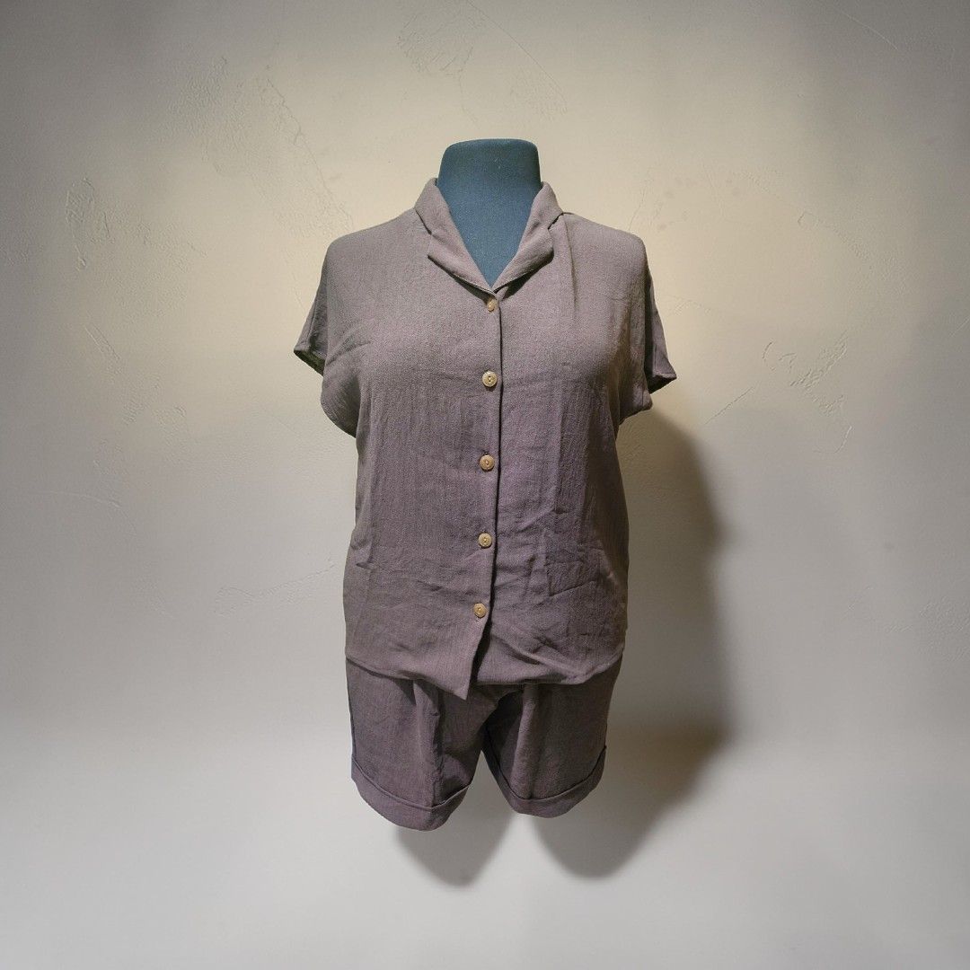 Brown Shorts Set (Category: Shorts) located in Antipolo. Submitted by swiftphoenix_21 (Listing ID 1430000017, Image 2). Description: Set includes a collared, button-down shirt with short sleeves and matching shorts. The shorts have an elastic waistband. The set is a solid brown color. It looks comfortable and suitable for casual wear..
