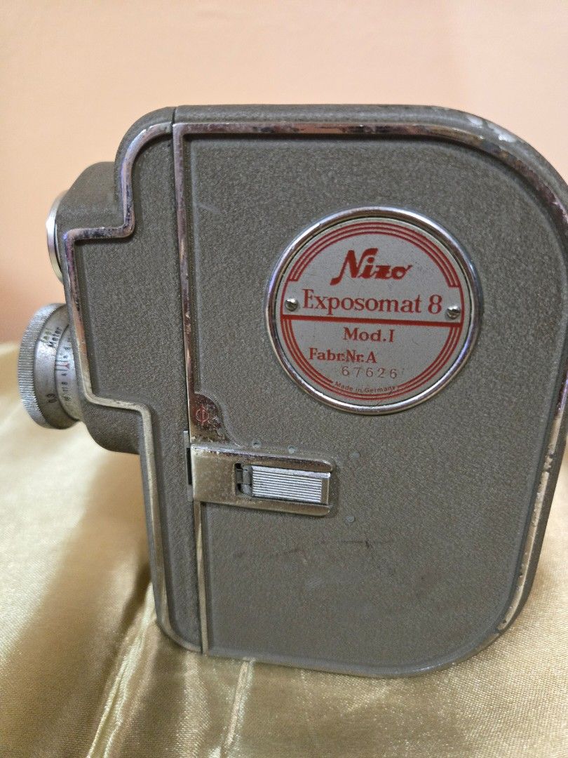 Camera (Category: Cameras) located in Singapore. Submitted by shamjay2467 (Listing ID 1429952814, Image 3). Description: - Vintage camera - Classic design - Metal detailing - Unique item for collectors - Perfect for film photography enthusiasts.