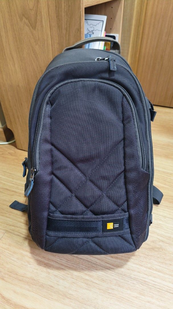 Case Logic Camera Backpack (Category: Camera Bags & Carriers) located in Singapore. Submitted by coolbread84 (Listing ID 1429854714, Image 1). Description: Features padded compartments for camera gear and accessories. Comfortable back support and adjustable straps. Perfect for photographers on the go. Zippers and straps are all in good working order..