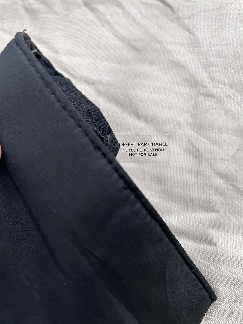 Chanel Maquillage Cosmetic Pouch (Category: Luxury Bags & Wallets) located in Calamba. Submitted by merrymerida (Listing ID 1429875876, Image 3). Description: Authentic Chanel Maquillage cosmetic pouch. Features a black nylon exterior with a zipper closure. The Chanel logo is printed on the front. The pouch measures approximately 9 inches in length and 5 inches in height. The tag indicates it is not for sale. Perfect for storing makeup or other s