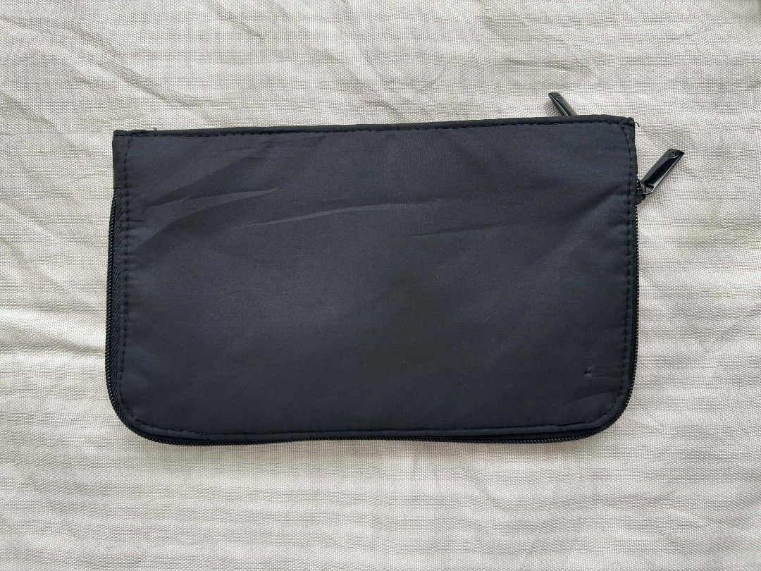 Chanel Maquillage Cosmetic Pouch (Category: Luxury Bags & Wallets) located in Calamba. Submitted by merrymerida (Listing ID 1429875876, Image 2). Description: Authentic Chanel Maquillage cosmetic pouch. Features a black nylon exterior with a zipper closure. The Chanel logo is printed on the front. The pouch measures approximately 9 inches in length and 5 inches in height. The tag indicates it is not for sale. Perfect for storing makeup or other s