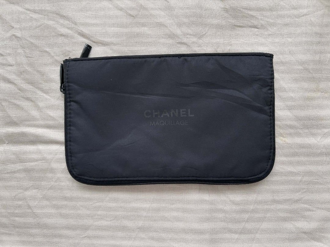 Chanel Maquillage Cosmetic Pouch (Category: Luxury Bags & Wallets) located in Calamba. Submitted by merrymerida (Listing ID 1429875876, Image 1). Description: Authentic Chanel Maquillage cosmetic pouch. Features a black nylon exterior with a zipper closure. The Chanel logo is printed on the front. The pouch measures approximately 9 inches in length and 5 inches in height. The tag indicates it is not for sale. Perfect for storing makeup or other s