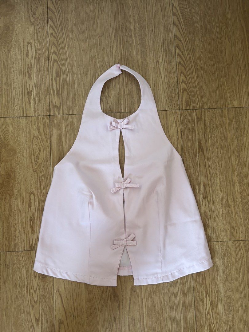 Coquette Pink Backless Halter Top with Bows (Category: Sleeveless) located in Caloocan City. Submitted by balugs_ (Listing ID 1429856300, Image 1). Description: Pink halter top features a unique design with bow details. It has a keyhole opening at the front and a gathered back. crop top pink top bows ribbon coquette .