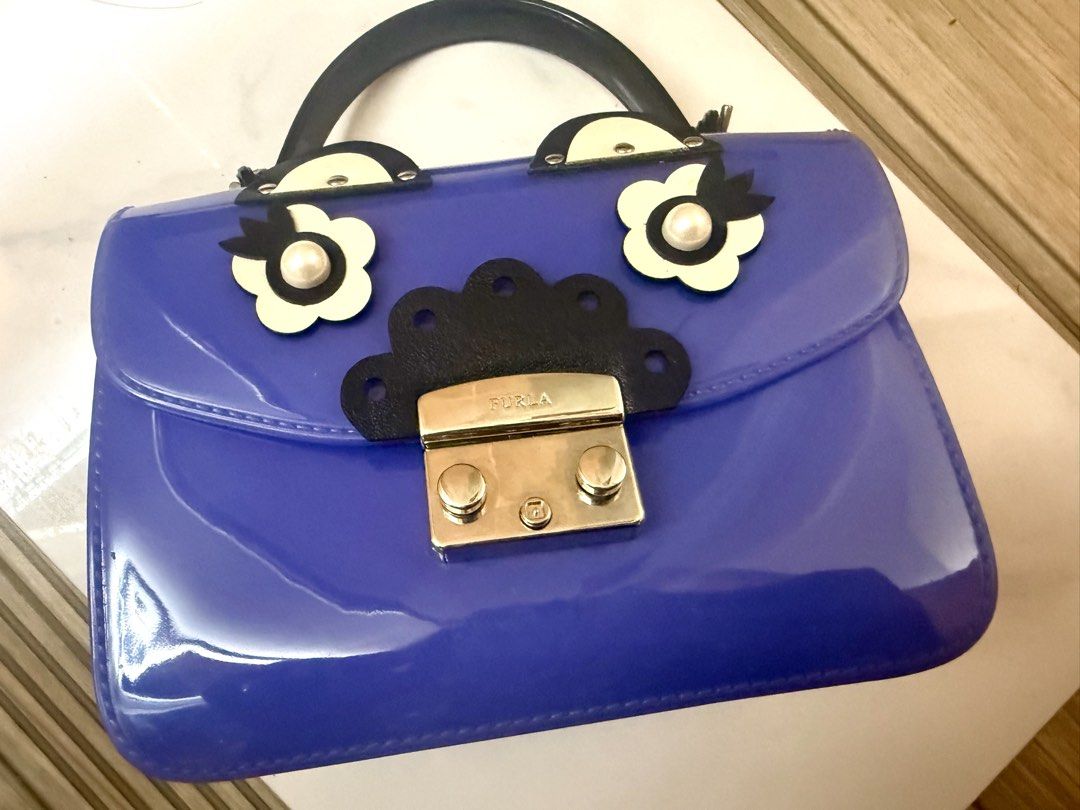Furla Bundle (Category: Luxury Bags & Wallets) located in Quezon City. Submitted by lineprelove23 (Listing ID 1429997450, Image 2). Description: - Furla Bundle - Includes a blue jelly bag with flower details - Includes a white crossbody bag - Perfect for everyday use - Adds a touch of luxury to your style -Brava Worth 15,000.