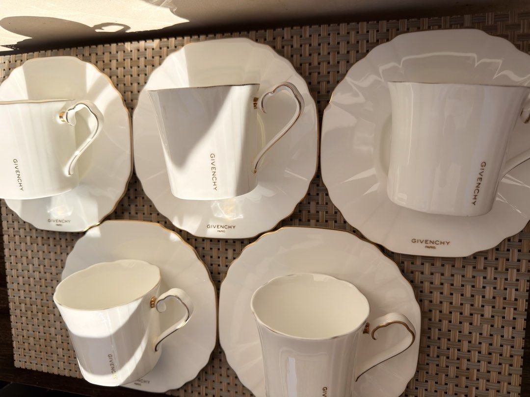 Givenchy Bone China Tea Cup and Saucer DUO (Category: Coffee & Tea Tableware) located in Bulacan. Submitted by fancy.surplusera (Listing ID 1429884869, Image 3). Description: Japan Elegant Givenchy tea cup and saucer set. Features a white bone china design with gold accents. Includes six cups and saucers. Made in Japan. Condition: 7/10 Size: Cup - 7cm x 7cm Saucer - 14.7cm Price sold per piece..