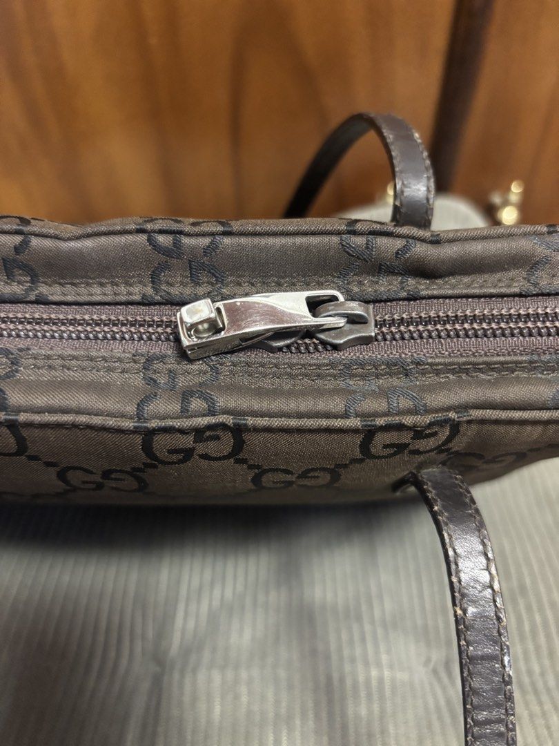 Gucci shoulder bag (Category: Luxury Bags & Wallets) located in Imus. Submitted by bagsofblessings24 (Listing ID 1429858289, Image 3). Description: Authentic preloved Gucci Nylon Tote bag ( small to medium) Coded Overall great condition No storage smell, clean inside and out Needs touch up of straps and re-stitching of one of the straps, crease sa side (need lang ng laman) Lock not available Supplier guaranteed authenticity, can also compare and 