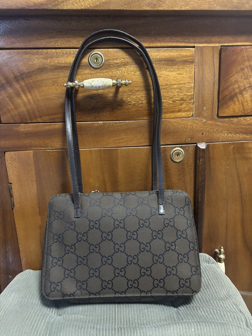 Gucci shoulder bag (Category: Luxury Bags & Wallets) located in Imus. Submitted by bagsofblessings24 (Listing ID 1429858289, Image 1). Description: Authentic preloved Gucci Nylon Tote bag ( small to medium) Coded Overall great condition No storage smell, clean inside and out Needs touch up of straps and re-stitching of one of the straps, crease sa side (need lang ng laman) Lock not available Supplier guaranteed authenticity, can also compare and 