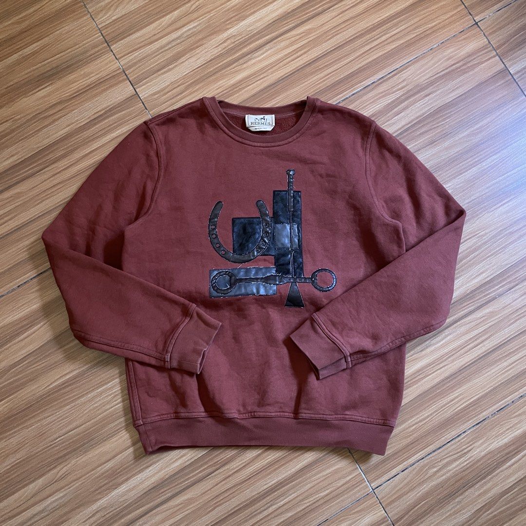 Hermes Puzzle Equestre Leather Patch Crewneck Sweatshirt (Category: Luxury Apparel) located in General Mariano Alvarez. Submitted by 4117_thriftnthrive (Listing ID 1429886583, Image 1). Description: Fair condition Loose stitch, scratch on leather Size on tag: S Measurements Width: 20” Length: 24”.