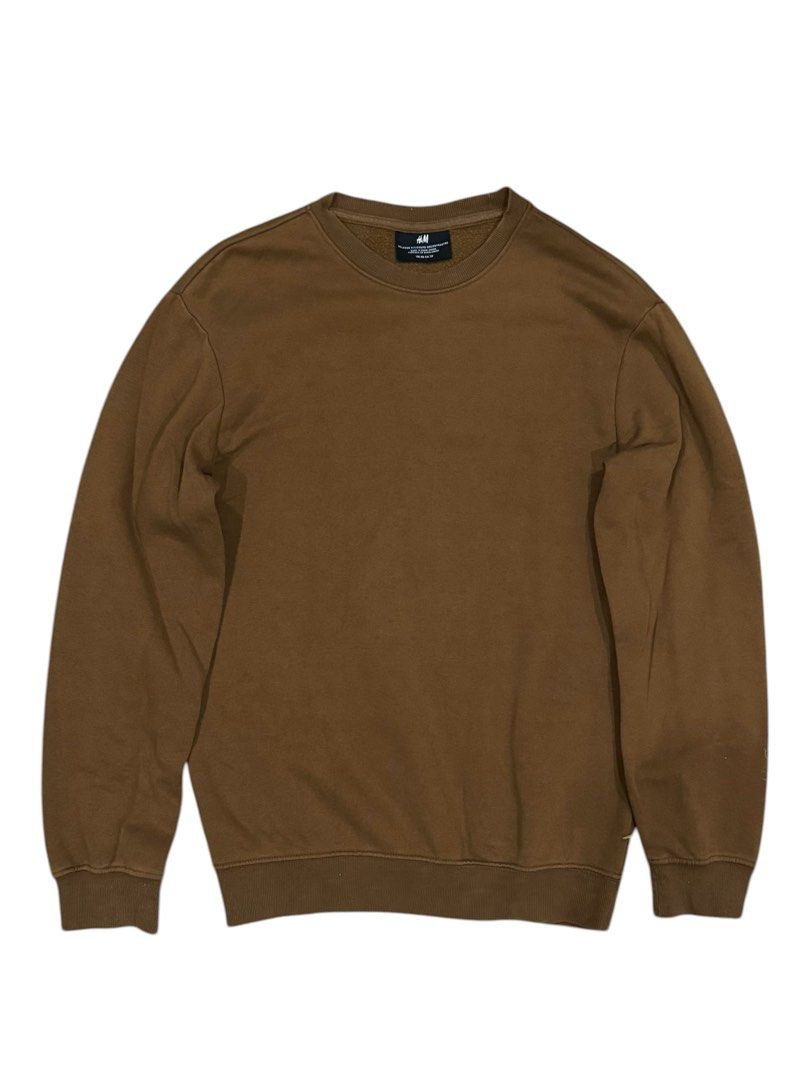 H&M Brown Crewneck Sweatshirt (Category: Coats, Jackets and Outerwear) located in Pasig City. Submitted by peter_german (Listing ID 1430014651, Image 1). Description: Very good condition with no flaws. Perfect for casual everyday wear. W: 20 inches L: 27 inches.