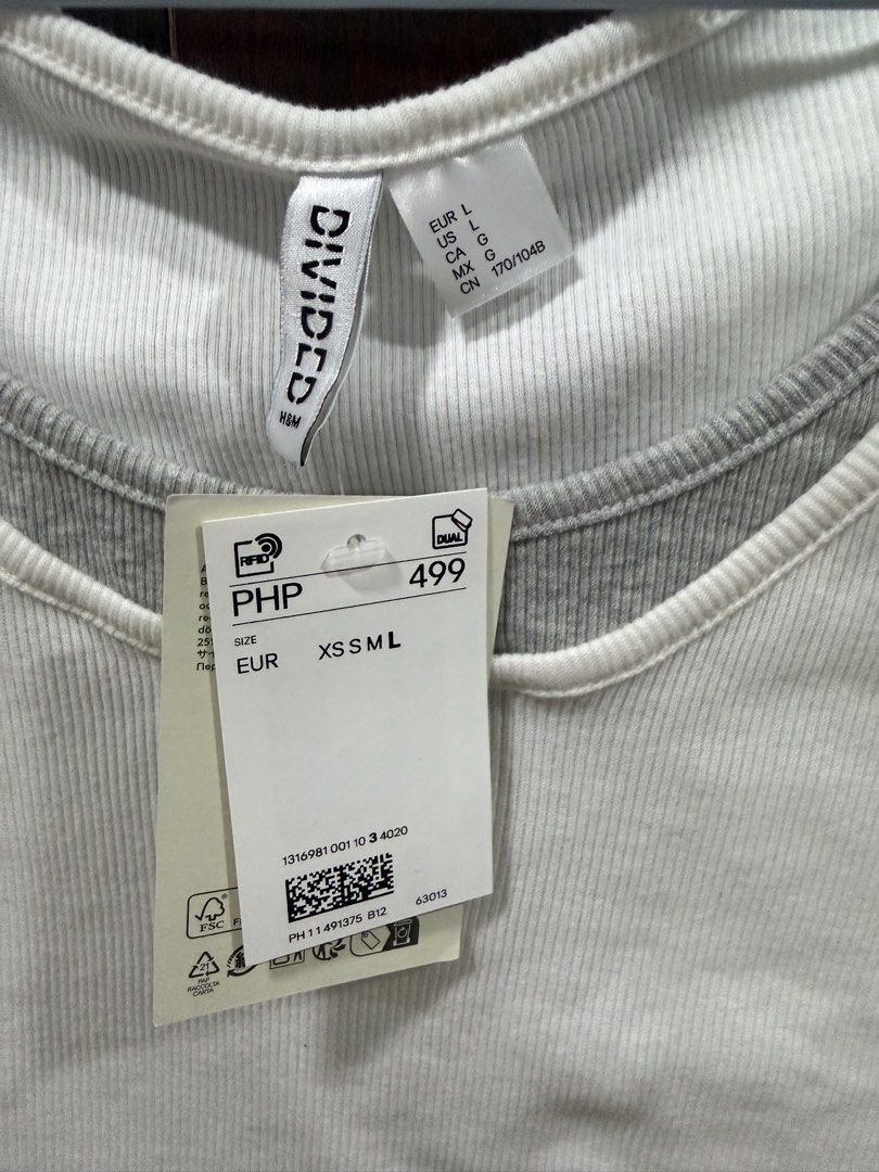 H&M Divided (Large) White and Grey Ribbed Top (Category: Sleeveless) located in Kawit. Submitted by sdzlyra (Listing ID 1429875785, Image 3). Description: Brand new with tags No issues Bought from H&M Rob Manila RFS: impulse buy haha Shipping via J&T/Lalamove SF c/o buyer Manila weekdays, Kawit Cavite weekends.