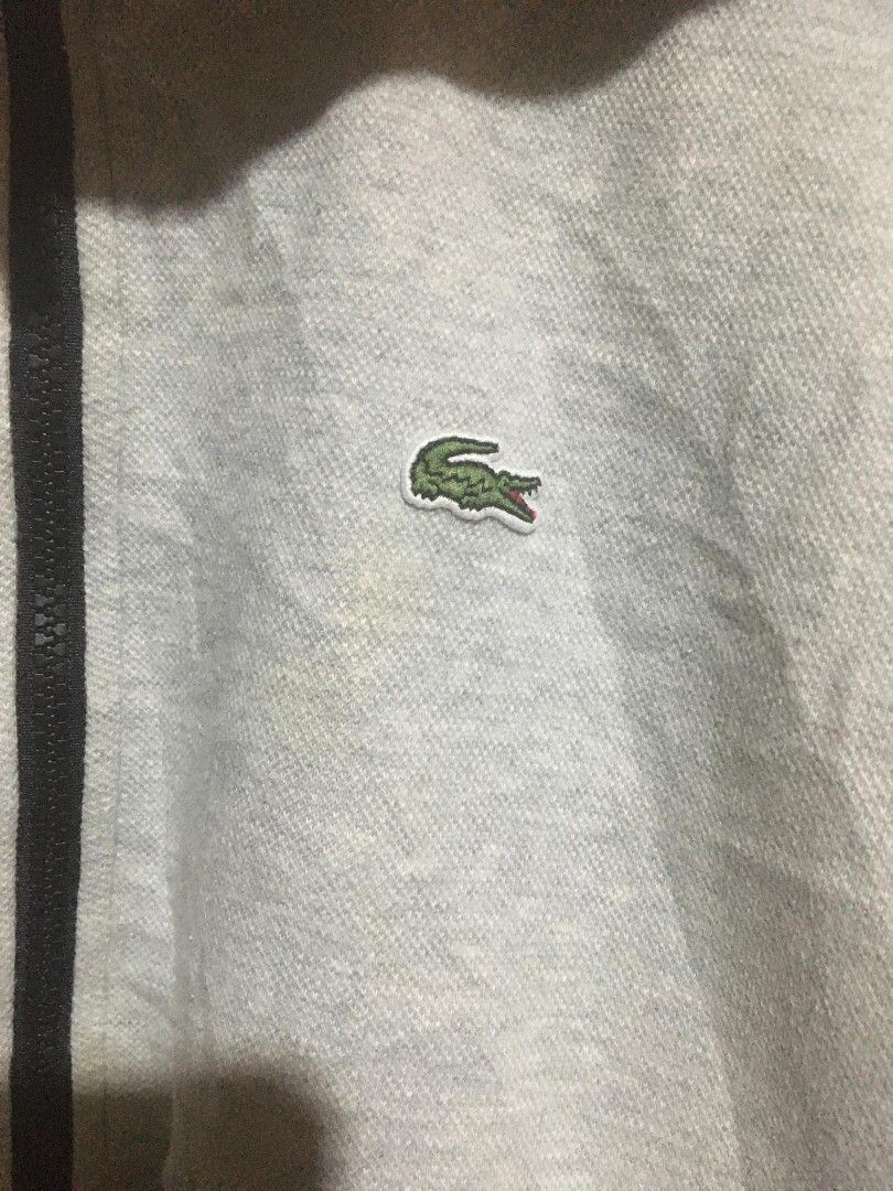 Lacoste Sport Hoodie (Category: Activewear) located in Surigao. Submitted by paulcorbeta (Listing ID 1429978336, Image 3). Description: - Lacoste Sport hoodie - Size: 34 - Full zip closure - Iconic Lacoste logo on chest - Material: Cotton/Polyester blend - Black trim along zipper.