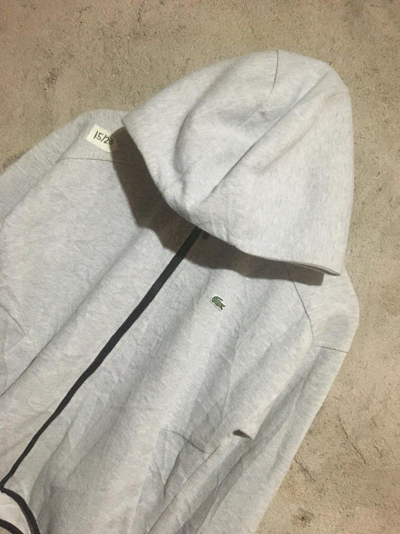 Lacoste Sport Hoodie (Category: Activewear) located in Surigao. Submitted by paulcorbeta (Listing ID 1429978336, Image 2). Description: - Lacoste Sport hoodie - Size: 34 - Full zip closure - Iconic Lacoste logo on chest - Material: Cotton/Polyester blend - Black trim along zipper.
