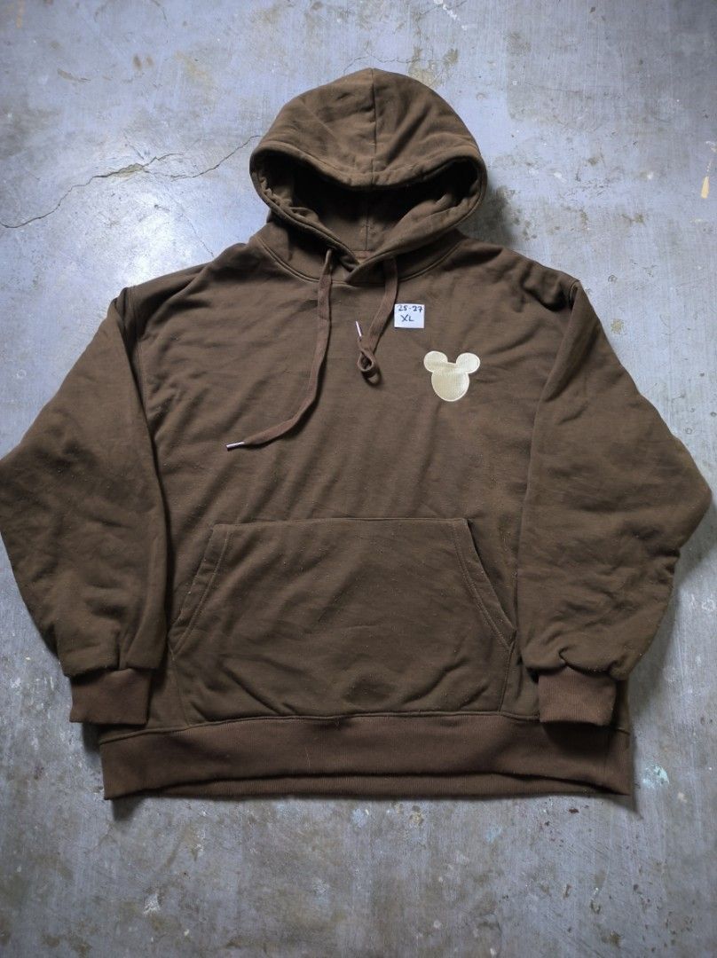 Mickey Mouse Brown Hoodie XL (Category: Hoodies) located in Manila. Submitted by suppliermo (Listing ID 1429909066, Image 1). Description: Brown hoodie with a Mickey Mouse design on the chest. Features a hood with drawstrings and a front pocket. The size tag indicates XL. The hoodie has ribbed cuffs and hem. The color is a solid brown..