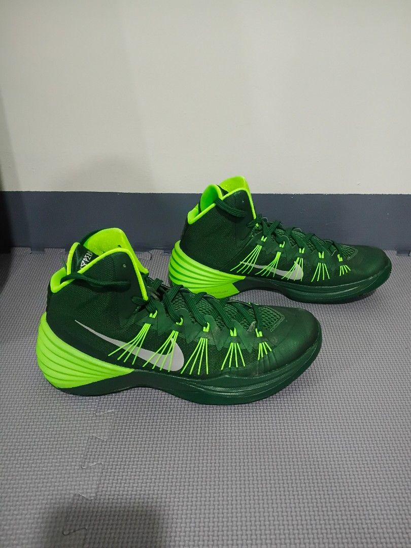 Nike Hyperdunk Green Basketball Shoes (Category: Sneakers) located in Marikina City. Submitted by littledearthings (Listing ID 1429903943, Image 2). Description: These Nike Hyperdunk basketball shoes feature a vibrant green color. The shoes have a high-top design with a cushioned sole and visible Nike swoosh. The size is US 11.5, UK 10.5, EUR 45.5, and 29.5 cm. .