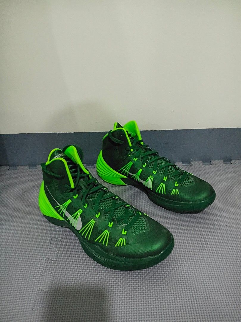 Nike Hyperdunk Green Basketball Shoes (Category: Sneakers) located in Marikina City. Submitted by littledearthings (Listing ID 1429903943, Image 1). Description: These Nike Hyperdunk basketball shoes feature a vibrant green color. The shoes have a high-top design with a cushioned sole and visible Nike swoosh. The size is US 11.5, UK 10.5, EUR 45.5, and 29.5 cm. .